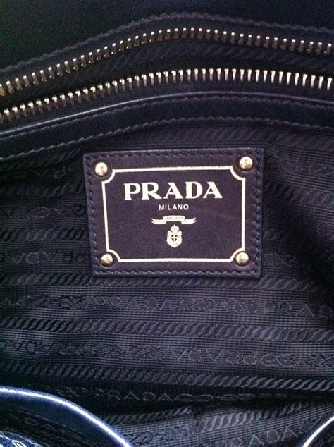 prada bag inside lining repairs.